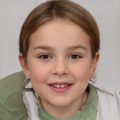 Joyful white child female with medium  brown hair and grey eyes