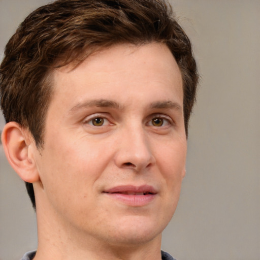 Joyful white adult male with short  brown hair and grey eyes