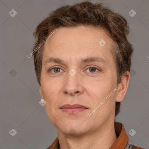 Joyful white adult male with short  brown hair and grey eyes