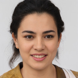 Joyful latino young-adult female with medium  brown hair and brown eyes