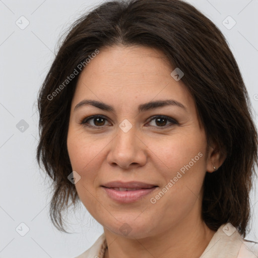 Joyful white adult female with medium  brown hair and brown eyes