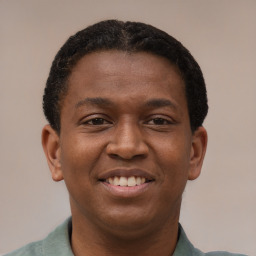 Joyful latino young-adult male with short  brown hair and brown eyes