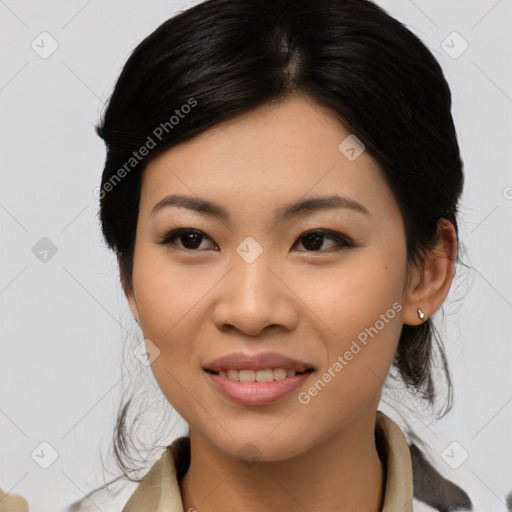 Joyful asian young-adult female with medium  black hair and brown eyes