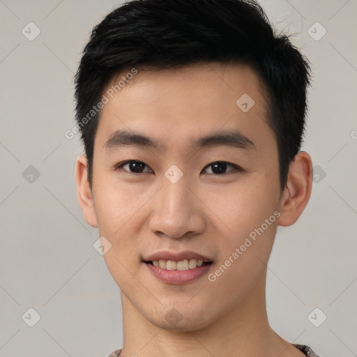 Joyful white young-adult male with short  black hair and brown eyes