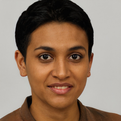 Joyful latino young-adult female with short  brown hair and brown eyes