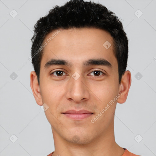 Joyful white young-adult male with short  black hair and brown eyes