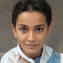 Joyful white child female with short  brown hair and brown eyes