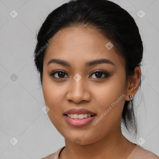 Joyful latino young-adult female with medium  brown hair and brown eyes