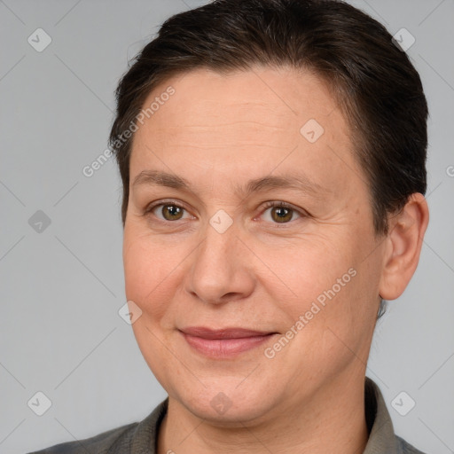 Joyful white adult female with short  brown hair and brown eyes