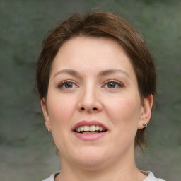 Joyful white adult female with short  brown hair and brown eyes