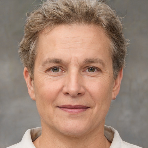 Joyful white middle-aged male with short  brown hair and brown eyes