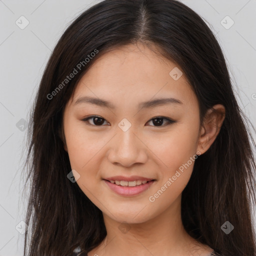 Joyful asian young-adult female with long  brown hair and brown eyes