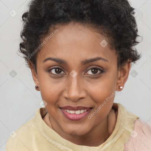 Joyful black young-adult female with short  brown hair and brown eyes