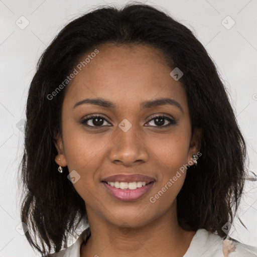 Joyful black young-adult female with medium  brown hair and brown eyes