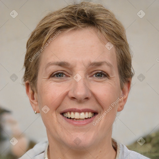 Joyful white adult female with short  brown hair and brown eyes