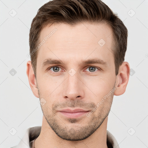 Neutral white young-adult male with short  brown hair and grey eyes