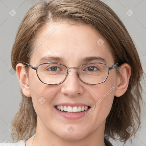 Joyful white adult female with medium  brown hair and grey eyes