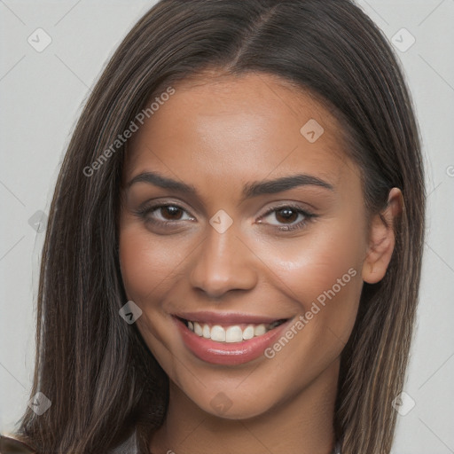 Joyful white young-adult female with long  brown hair and brown eyes