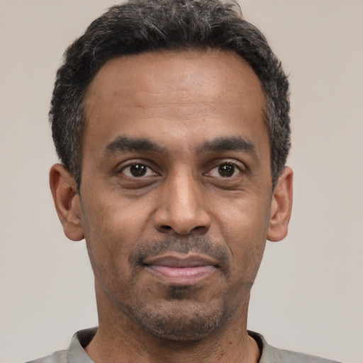 Neutral latino adult male with short  black hair and brown eyes