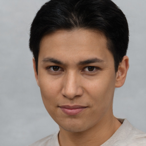 Joyful asian young-adult female with short  brown hair and brown eyes