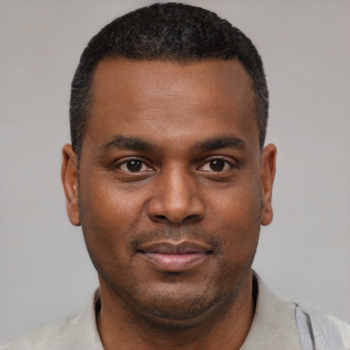 Neutral black young-adult male with short  black hair and brown eyes