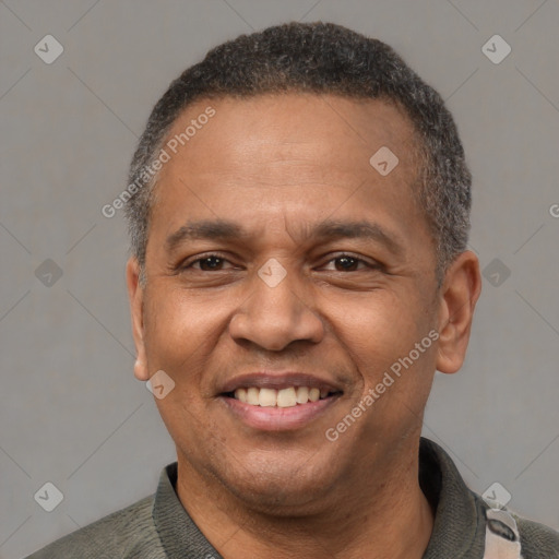 Joyful latino adult male with short  brown hair and brown eyes