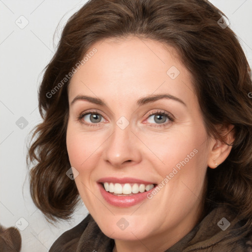 Joyful white adult female with medium  brown hair and green eyes