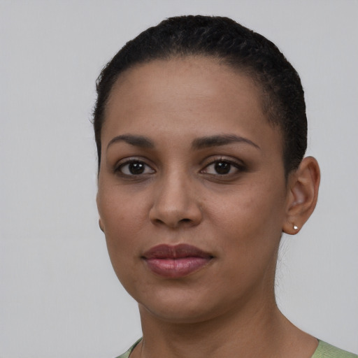 Joyful latino young-adult female with short  black hair and brown eyes