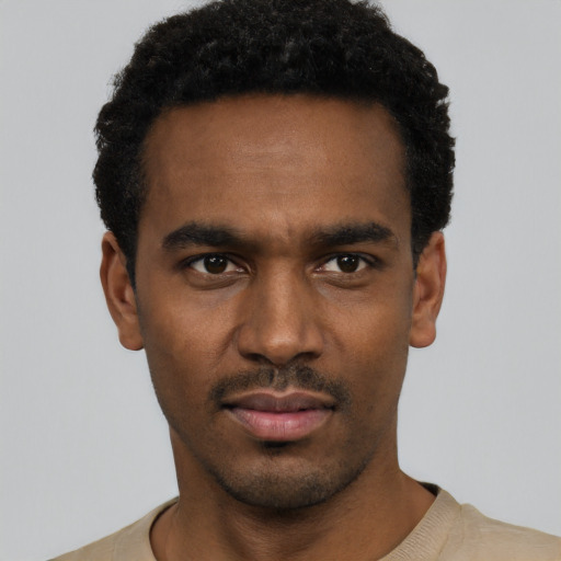 Neutral black young-adult male with short  black hair and brown eyes