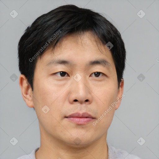 Neutral asian young-adult male with short  brown hair and brown eyes