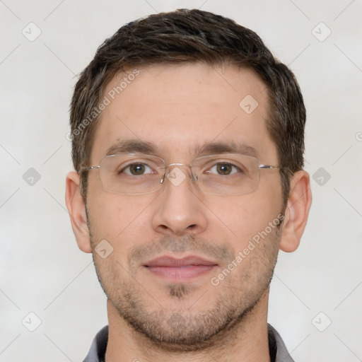 Joyful white adult male with short  brown hair and brown eyes