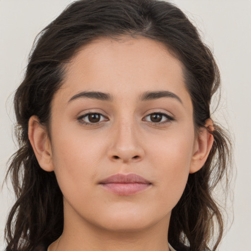 Joyful white young-adult female with long  brown hair and brown eyes