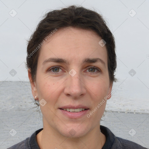 Joyful white adult female with short  brown hair and brown eyes