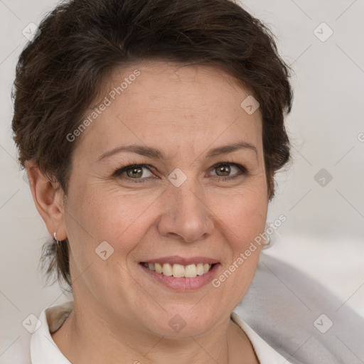 Joyful white adult female with short  brown hair and brown eyes