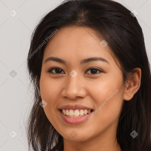 Joyful latino young-adult female with long  brown hair and brown eyes