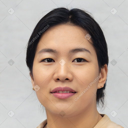 Joyful asian young-adult female with short  black hair and brown eyes