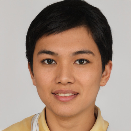 Joyful asian young-adult male with short  black hair and brown eyes