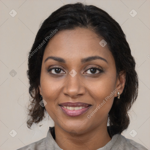 Joyful black young-adult female with medium  brown hair and brown eyes