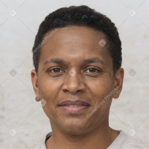 Joyful latino adult male with short  black hair and brown eyes