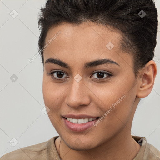 Joyful white young-adult female with short  brown hair and brown eyes