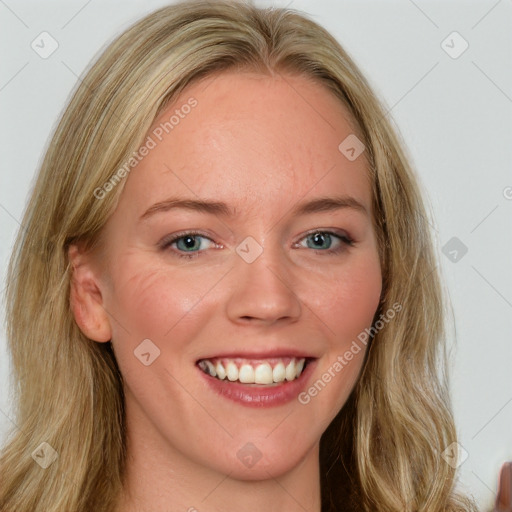 Joyful white young-adult female with long  brown hair and blue eyes
