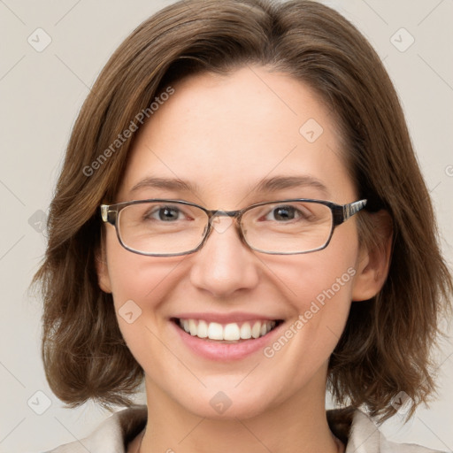 Joyful white adult female with medium  brown hair and blue eyes