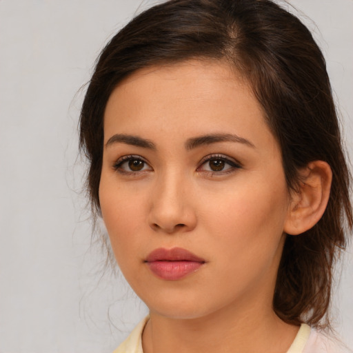 Neutral asian young-adult female with medium  brown hair and brown eyes