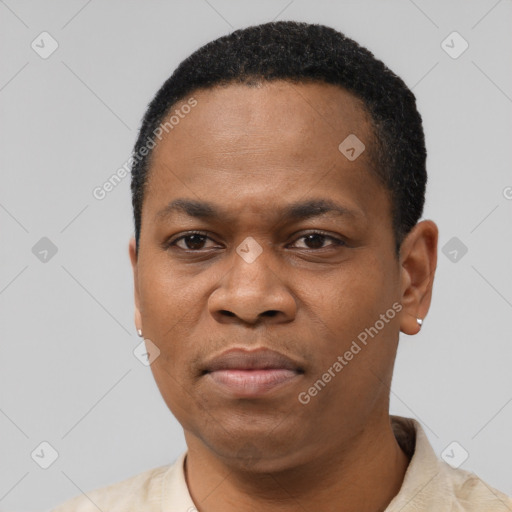 Neutral latino adult male with short  black hair and brown eyes