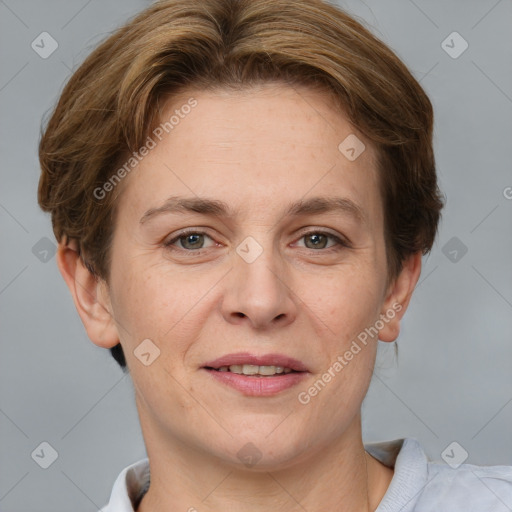 Joyful white adult female with short  brown hair and grey eyes