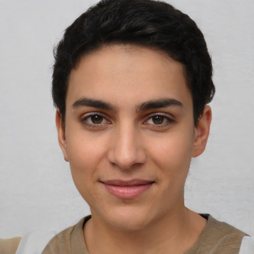 Joyful latino young-adult female with short  brown hair and brown eyes