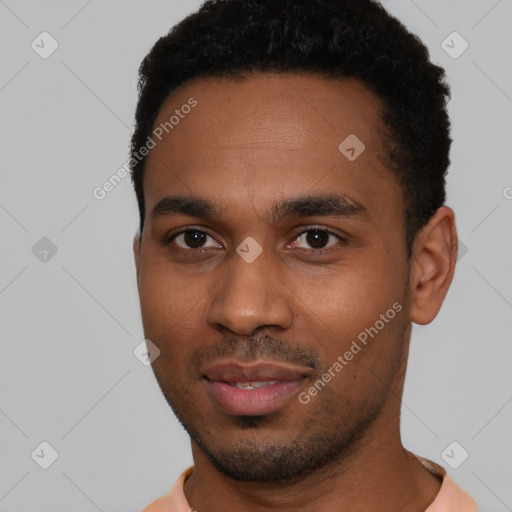 Joyful black young-adult male with short  black hair and brown eyes