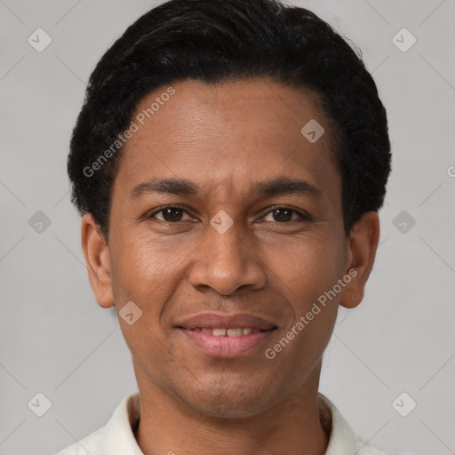 Joyful latino young-adult male with short  brown hair and brown eyes