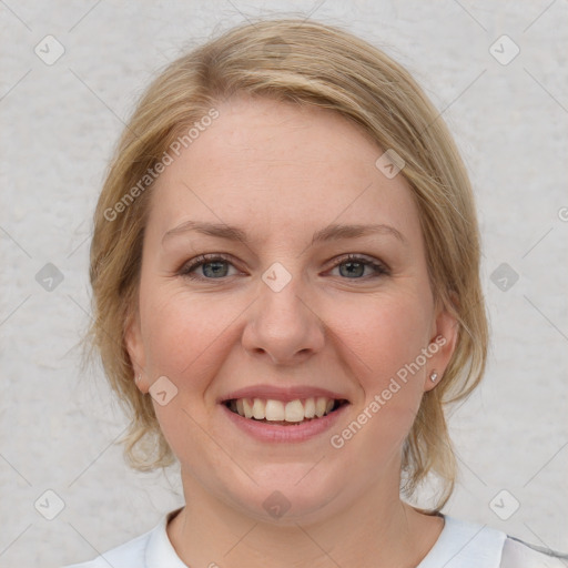 Joyful white young-adult female with medium  brown hair and blue eyes