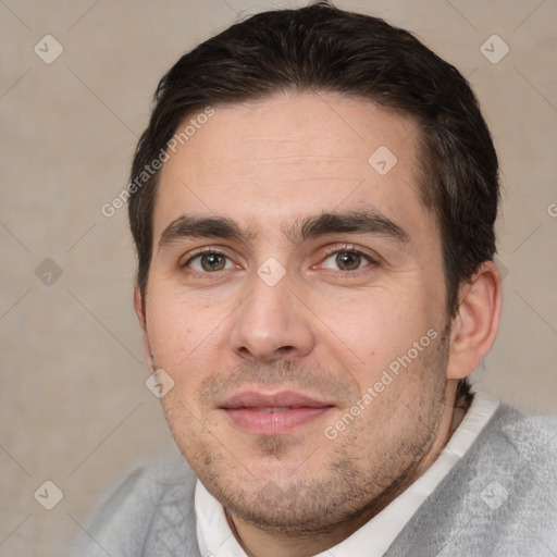 Joyful white adult male with short  brown hair and brown eyes